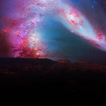 Landscape with backdrop of stars in pink and red hues